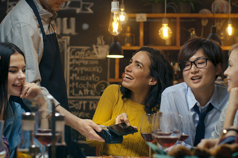 Making a payment via mobile wallet at a restaurant