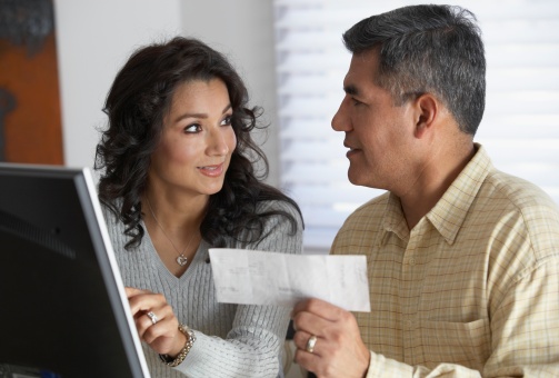 couple looking at check