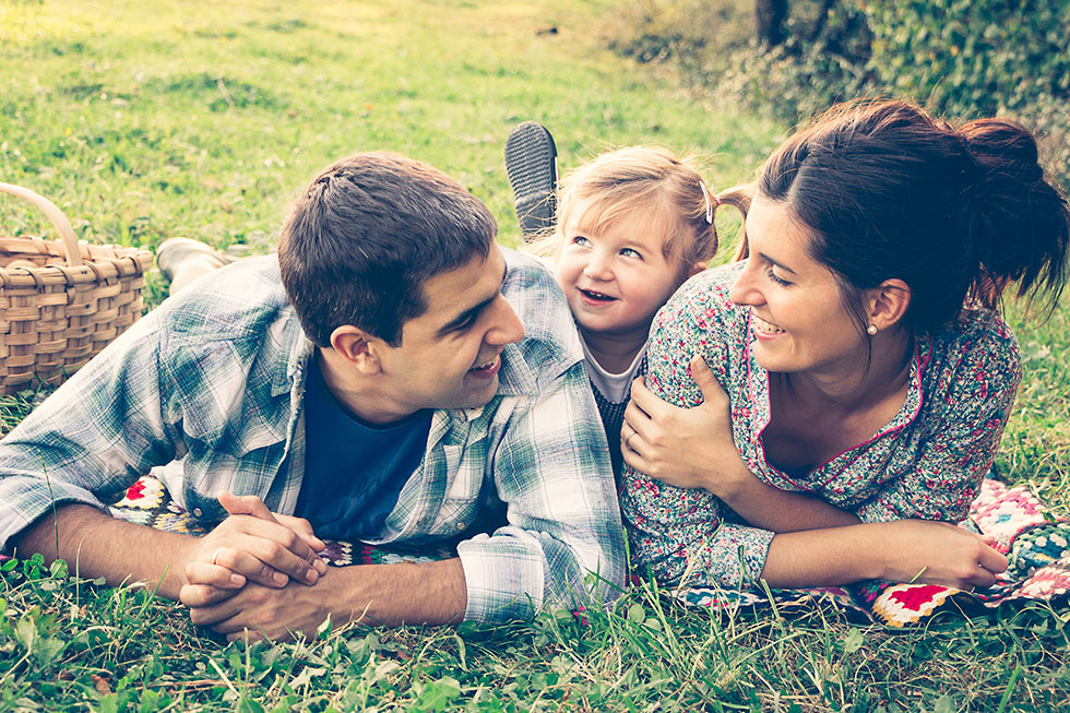 Family of three in park