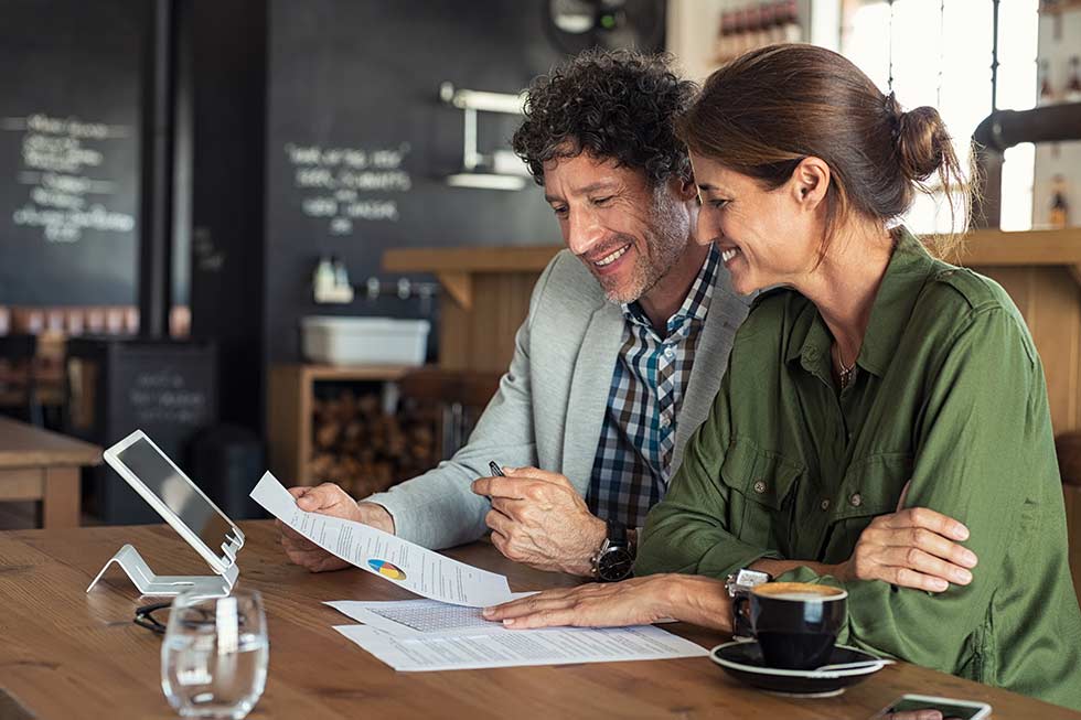 happy couple looking over finances